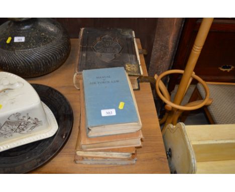 A Manual of Air Force law; together with a Victorian leather bound Bible AF; and three other books 