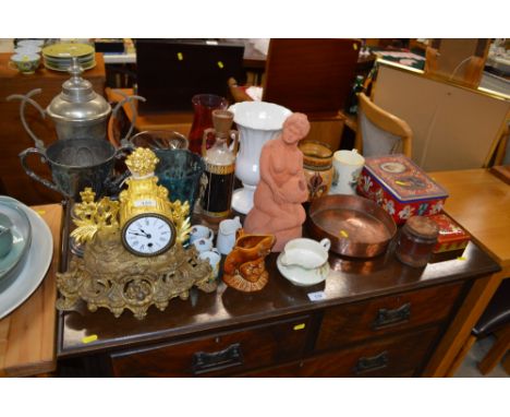 A gilt metal single hole mantel clock; together with two trophy cups; various vases; a terracotta pottery figurine etc. 