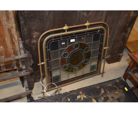 A brass and stained glass firescreen