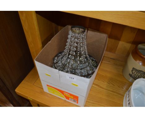 A box containing brass and glass light fittings 