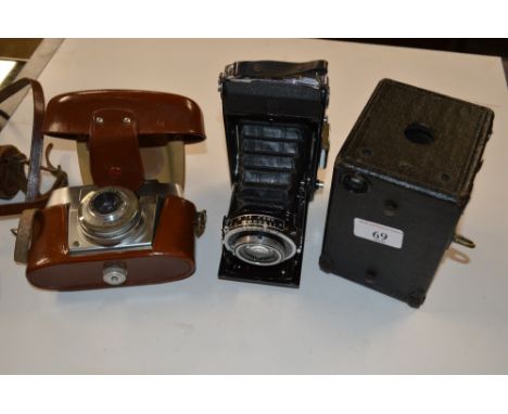 A Zeiss Ikon camera; together with an Agfa camera; and a Box Brownie camera 