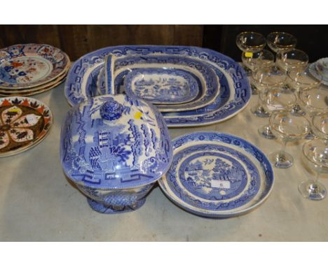 Three blue and white old willow patterned meat plates; together with a matching soup tureen and ladle and comport