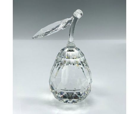 A clear figure of a pear with a faceted body and leaf modeled stem. Swarovski mark. This item has its original box: 5"H x 6" 