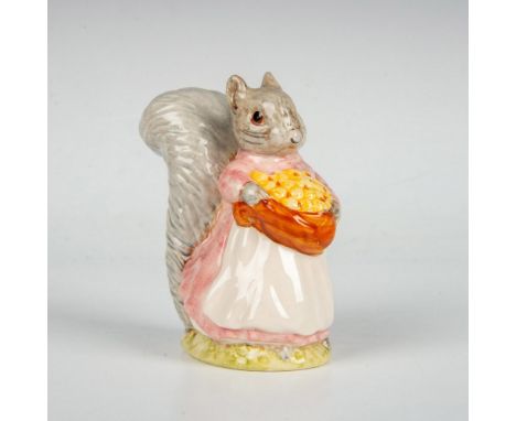 Squirrel figurine colored in gray, pink and white holding basket with yellow nuts. Beswick backstamp. This item has its origi
