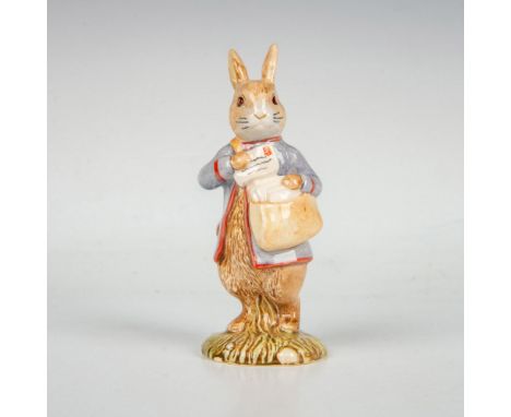 Peter Rabbit in blue coat carrying a postbag and a letter. Royal Albert backstamp. This item has its original box. Box measur