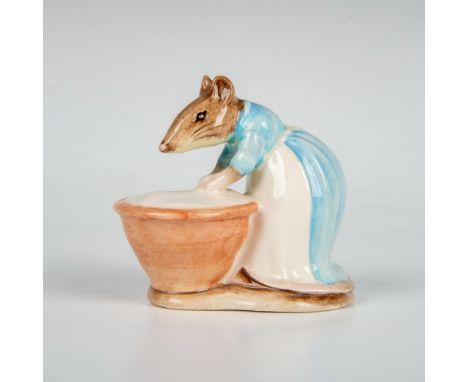 The character is modeled in a blue dress with white apron with a bowl of dough. Beswick backstamp. This item has its original