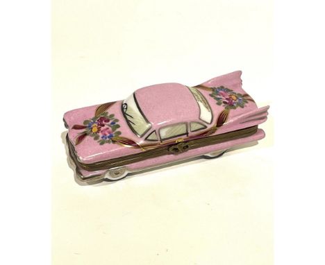 Elaborately decorated wedding limo with long tail fins hand painted with 22KT gold and magenta accents. Bouquets of pink rose