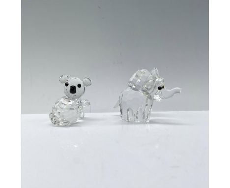 An adorable koala (119472) seated with outstretched arms and a baby elephant (151489) boasting a raised trunk and ears, both 