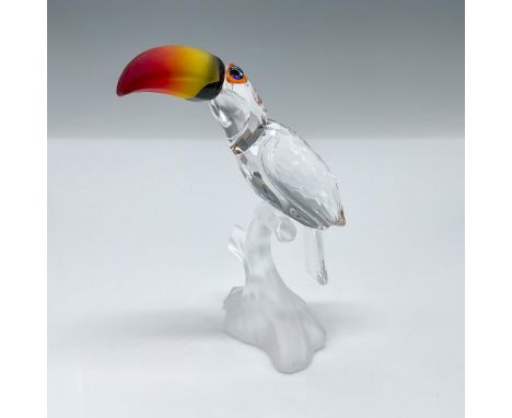 This crystal toucan was made from clear crystal and sits on a frosted branch. His beak is made from fire opal crystal. The to