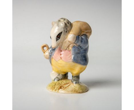 Character is modeled in a blue jacket, yellow trousers and a pink waistcoat. Includes the original box, dimensions: 3''L x 3'