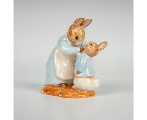 Glossy porcelain bunny is modeled as mommy bunny in a blue dress with apron buttoning Peter's blue jacket. Royal Albert Beatr