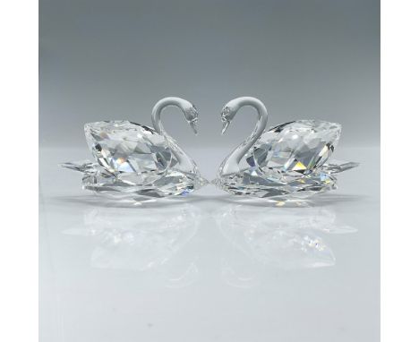 When placed together, the necks of the elegant and graceful swans create the shape of a heart. Made of clear faceted crystal 