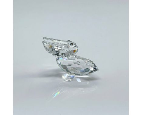 Clear faceted figure of a water bird with blue-green eyes. Part of the Feathered Friends collection. Swarovski etched mark. T
