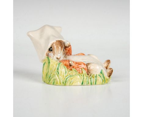 Reclining rabbit with white bag over its head. This item has its original box measuring 3"L x 3"W x 4.25"H. Royal Albert back