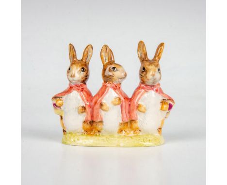 Three rabbits wearing cloaks. This item has its original box measuring 3"L x 3"W x 4.25"H. Beswick backstamp. Artist: Arthur 