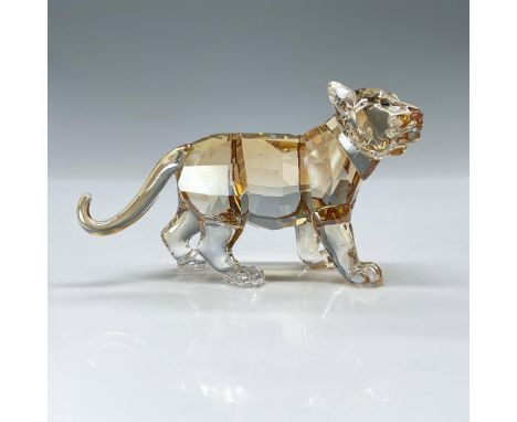 Shimmers in fully facetted golden shine crystal with satin crystal stripes. Swarovski backstamp. Item comes with original box