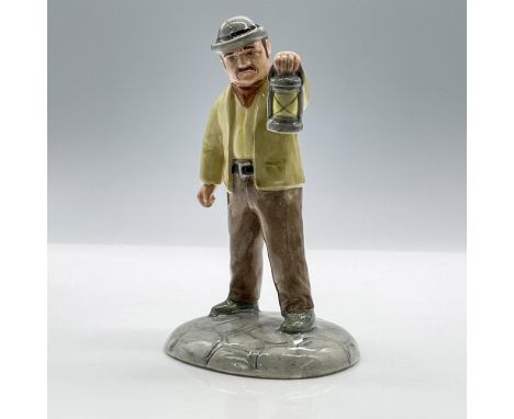 A farmer holding a lantern checking on his crop. The piece is made of porcelain with a glossy finish. F. Warne And Company, R