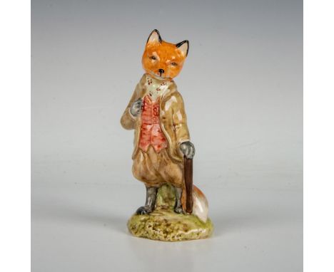 Brown fox figurine in brown coat and pants with a red vest. Leaning on a cane. Beswick backstamp. This item has its original 