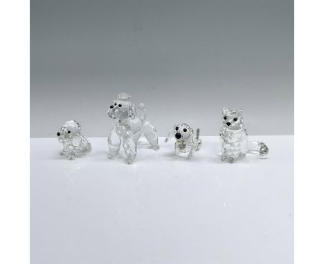 A set of four clear crystal animals, that includes Poodle (167571), Beagle Puppy (158418), Sitting Dachshund (010003), and Si