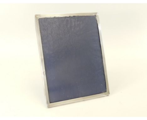 SILVER FRAME. A mid 20th century engine turned silver photograph frame. 31 x 23cm.
