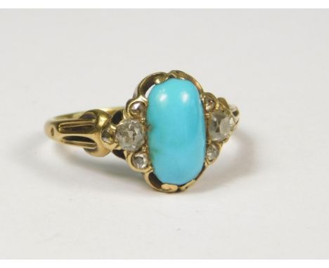 TURQUOISE RING.A 19th century yellow metal ring set an oval cabouchon turquoise, with three old cut diamonds to either side. 