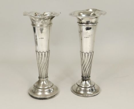 SILVER VASES. A pair of Edwardian William Hutton &amp; Sons, half fluted silver vases. Height 25cm.