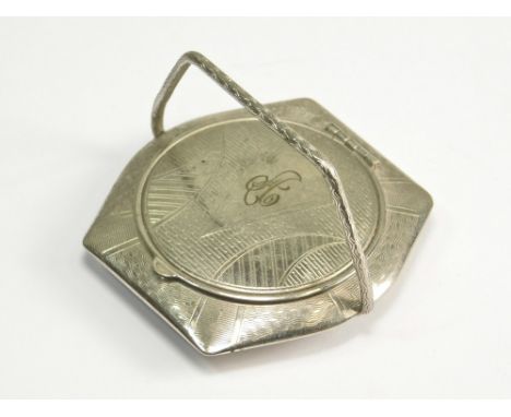 POWDER COMPACT. An engine turned white metal powder compact with swing handle.