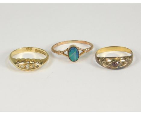 GOLD RINGS. An 18ct. gold five stone diamond ring, a 9ct. gold opal doublet ring &amp; one other ring.