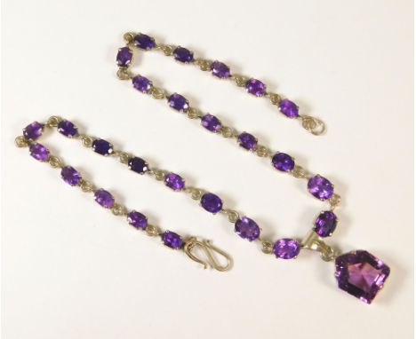 INDIAN SILVER. An Indian silver necklace set with amethyst coloured stones.