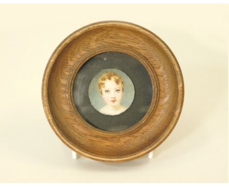 PORTRAIT MINIATURE. A 19th century portrait miniature on ivory of a young child. Unsigned. Image diameter 3.5cm.