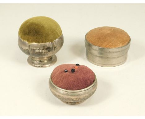 PIN CUSHION ETC.A Mappin & Webb silver mounted pedestal pin cushion, an EPNS pin cushion & a white metal pin cushion box with