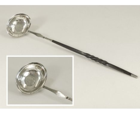 PUNCH LADLE. A Georgian silver punch ladle, the bowl with George IV coin.