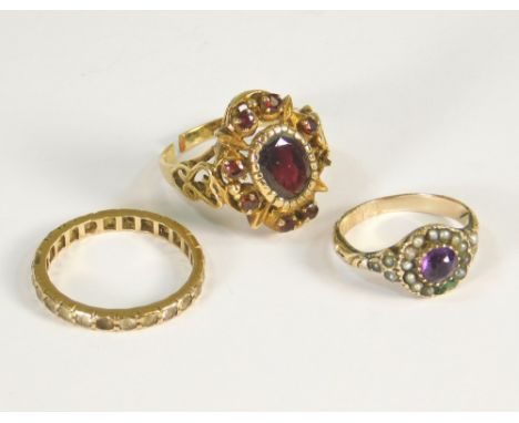 DRESS RINGS. A Victorian amethyst &amp; half pearl ring, a paste set eternity ring &amp; a 9ct. gold &amp; garnet set ring (s