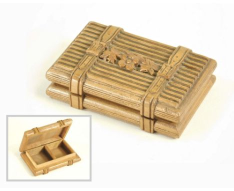 STAMP BOX. A double compartment wooden stamp box, carved as a travelling trunk with straps. 4.5 x 7cm.