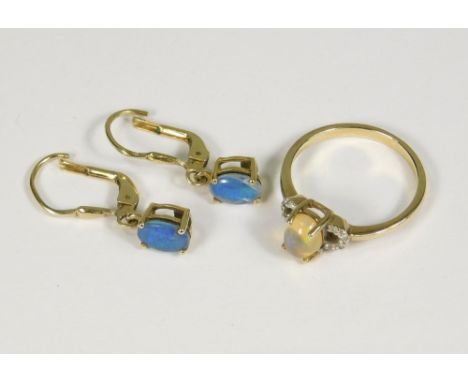 GOLD RING ETC. A 9ct. gold Ethiopian opal dress ring &amp; a pair of boulder opal earrings set in silver gilt.