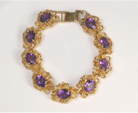 AMETHYST BRACELET. A 9ct. gold amethyst set bracelet fastened with 9ct. gold Omega watch clasp. Approx. 35.1g.