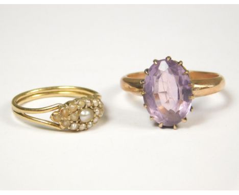 GOLD RINGS. A Victorian ring set a faceted amethyst & a Victorian ring set an arrangement of seed pearls.