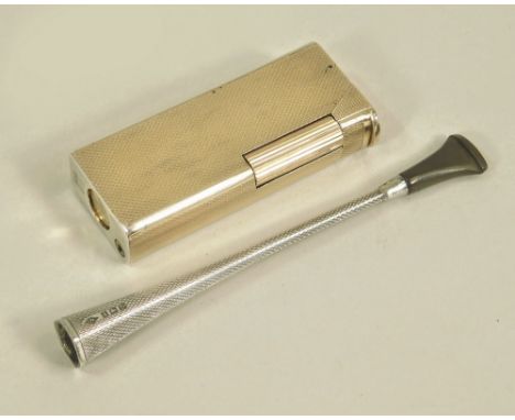 CIGARETTE HOLDER ETC. An Alfred Dunhill engine turned silver cigarette holder, Birmingham 1953. Also, a Dunhill Paris silver 