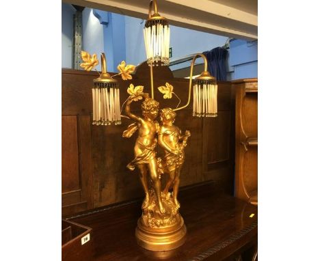 A cherub three branch table lamp