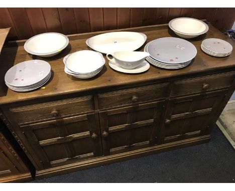 An Ercol three drawer dresser base, 140cm wide