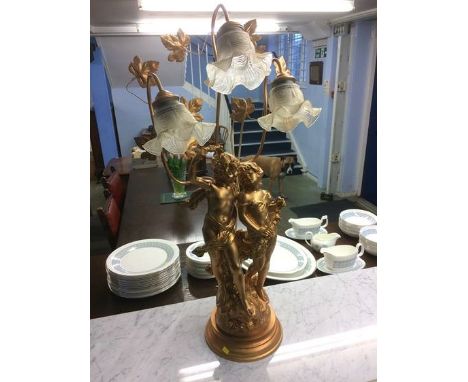 A decorative cherub three branch table lamp