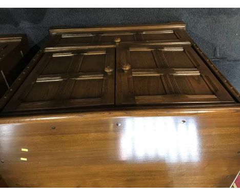 An Ercol TV cabinet, 91cm wide