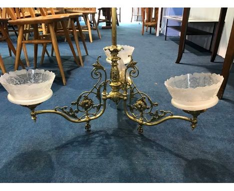 A brass hanging three branch ceiling light, with three etched glass shades