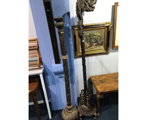 A Chinese hardwood carved dragon hanging lamp and another bamboo carved standard lamp (2)