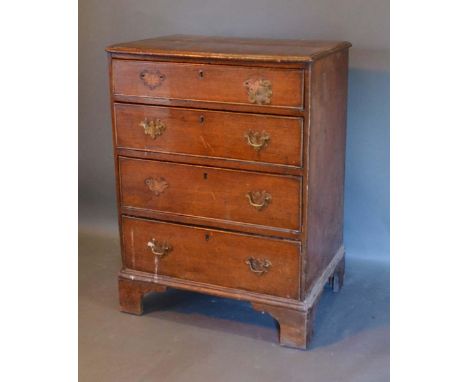 A 19th Century Oak and Pine Chest, the moulded top above four drawers with brass handles raised upon bracket feet, 69cm wide,