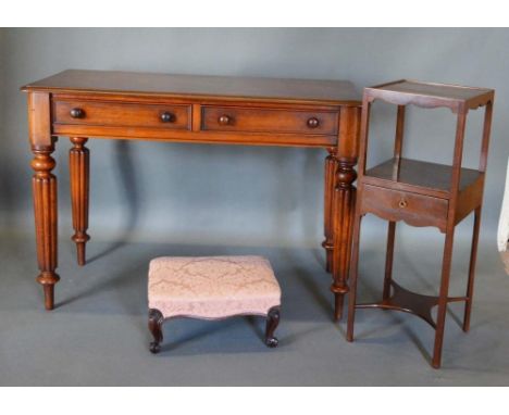 A 19th Century Mahogany Side Table, the moulded top above two frieze drawers with knob handles raised upon tapering reeded le