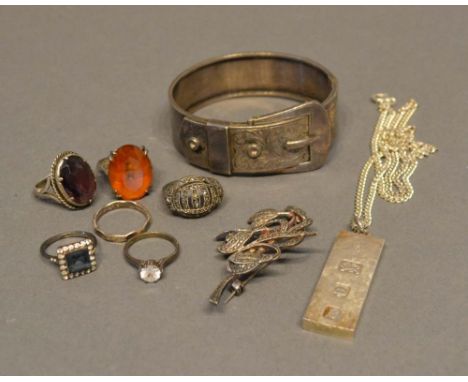 A Chester Silver Bangle in the form of a buckle, together with six silver dress rings, a marcasite brooch and a heavy silver 