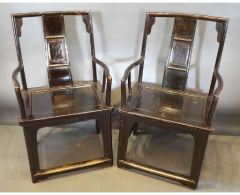 A Pair of 19th Century Chinese Hardwood Armchairs, each with a carved back above a panel seat, raised upon square legs with s