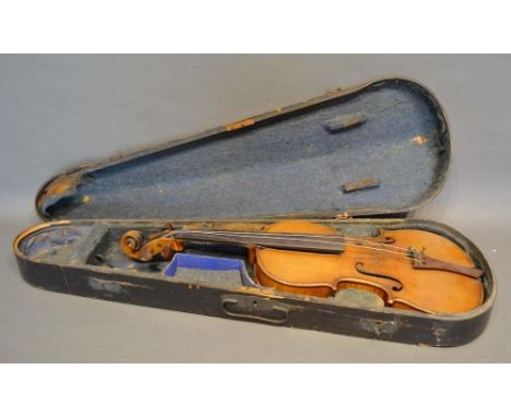 A German Violin with two piece back and ebony fretboard, bearing label 'Copy of a Stradivarius', within ebonised case 