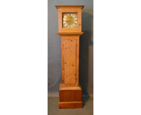 A Pine Longcase Clock with a square hood above a rectangular door and conforming plinth base, the brass dial inscribed Richar